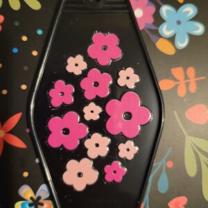Black motel key with pink flowers