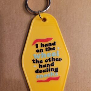 One hand on the wheel